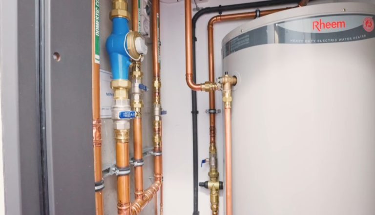 Pipes and valves near Rheem heater.