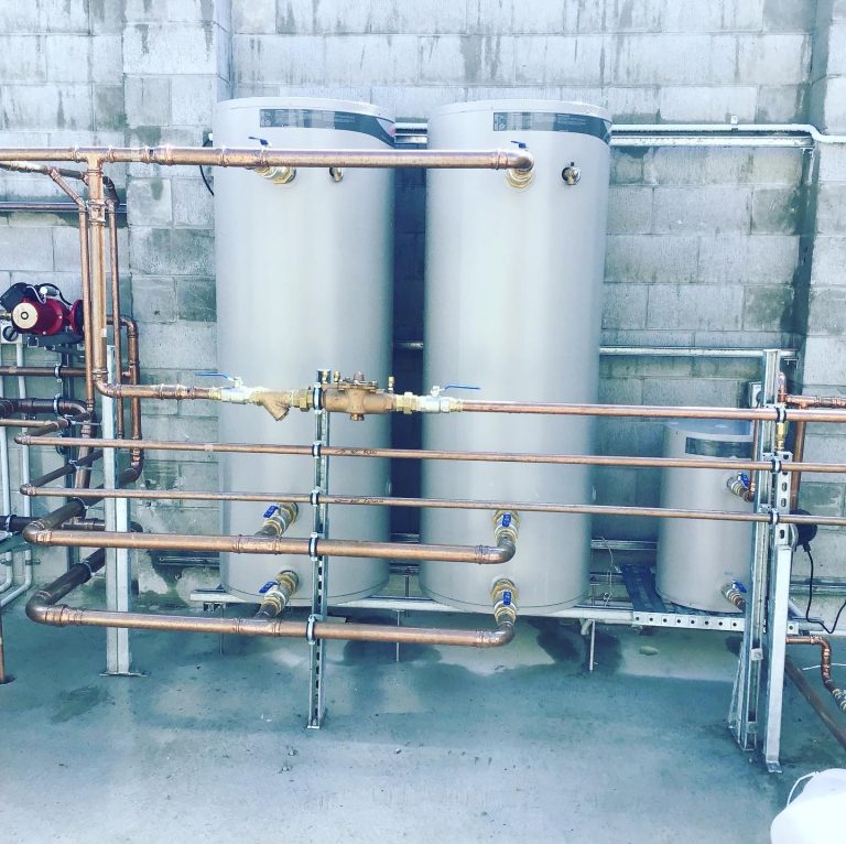 Industrial water heaters, pipes, smaller tank.