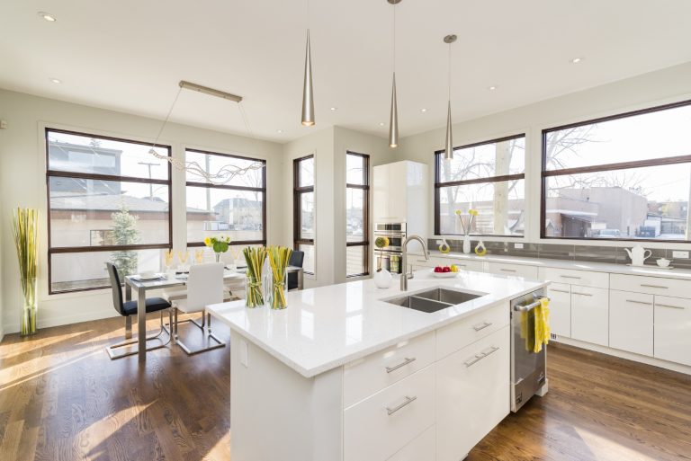 Bright kitchen with island, dining area.